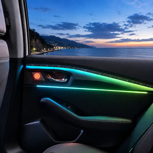 Automotive panel ambient light installed on a car door trim, creating a premium interior atmosphere during a coastal blue hour drive.
