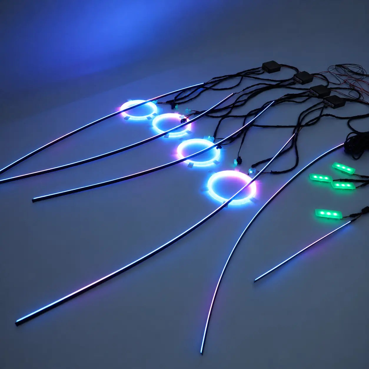 Universal RGBIC car interior panel ambient light kit illuminated with dynamic multicolor lighting, featuring door panel light bars, speaker ambient lights, dashboard light and synchronized RGBIC lighting effects.